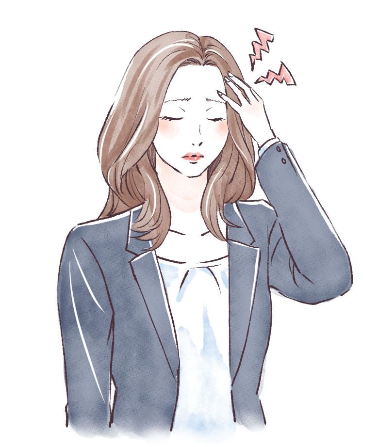 頭痛で頭を抱える女性